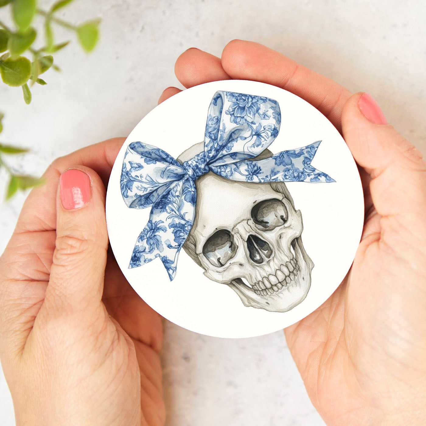 Floral skull coaster in blue and white chinoiserie pattern with cork backing
Bow skull Halloween coaster with delicate blue floral details